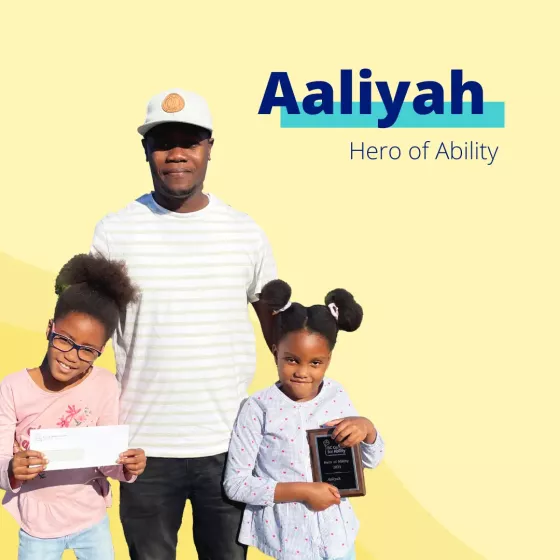 Aaliyah with her sister and her dad on a yellow background